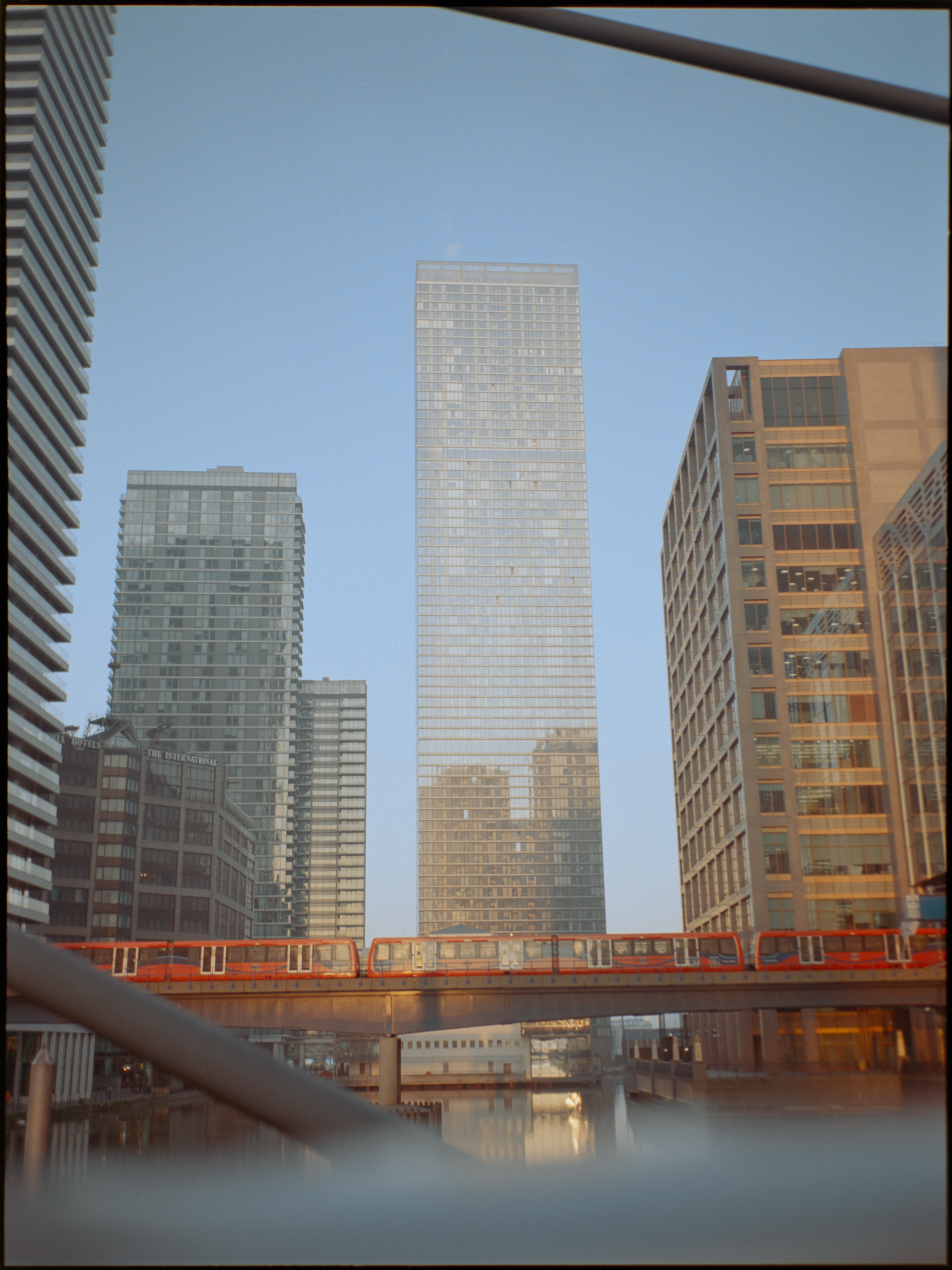 Canary Wharf towers reflected in dock water — Fujifilm GA645S Kodak Portra 160