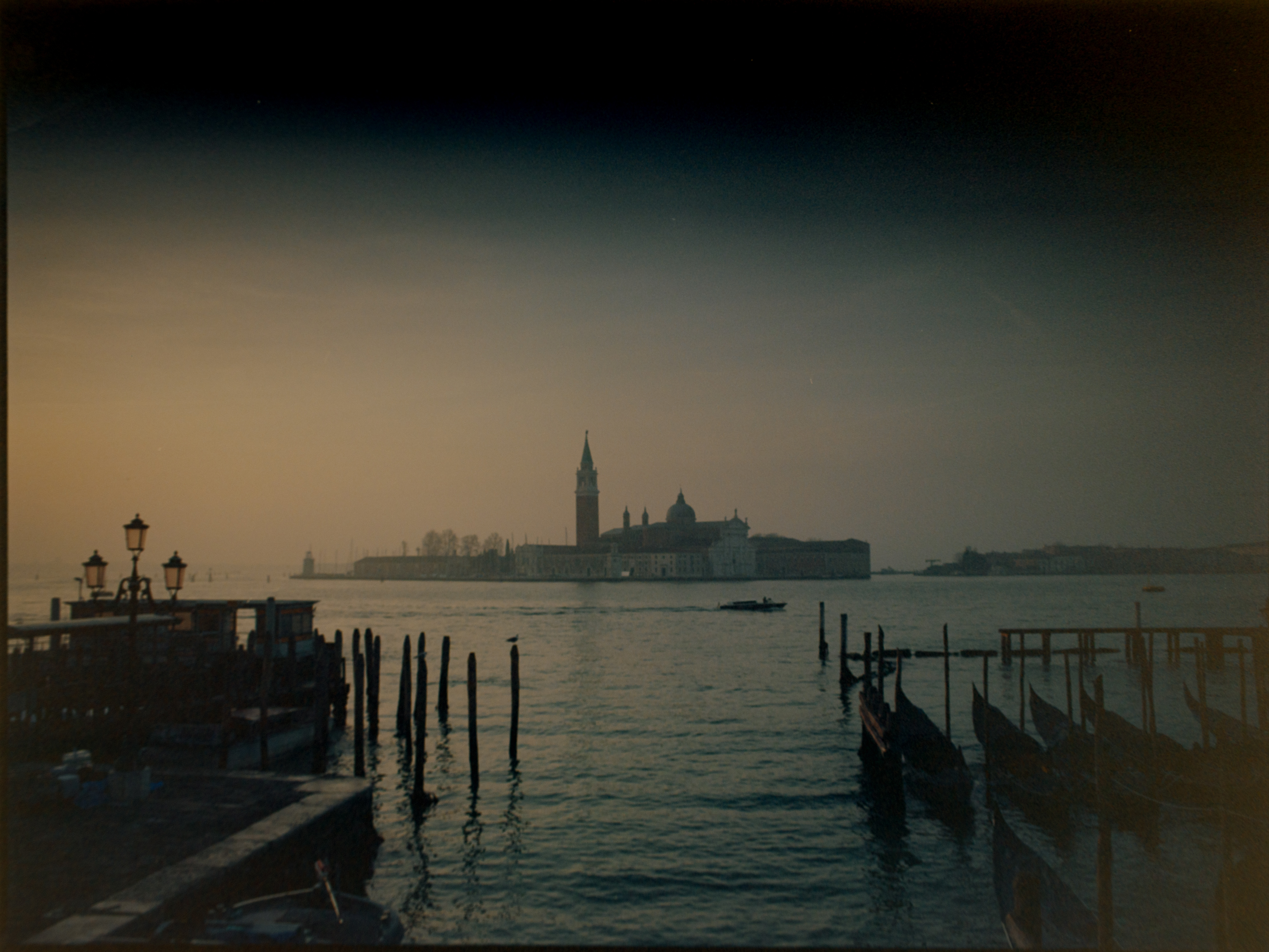 Dark moody view across the lagoon to San Giorgio Maggiore at twilight — Venice on medium format film