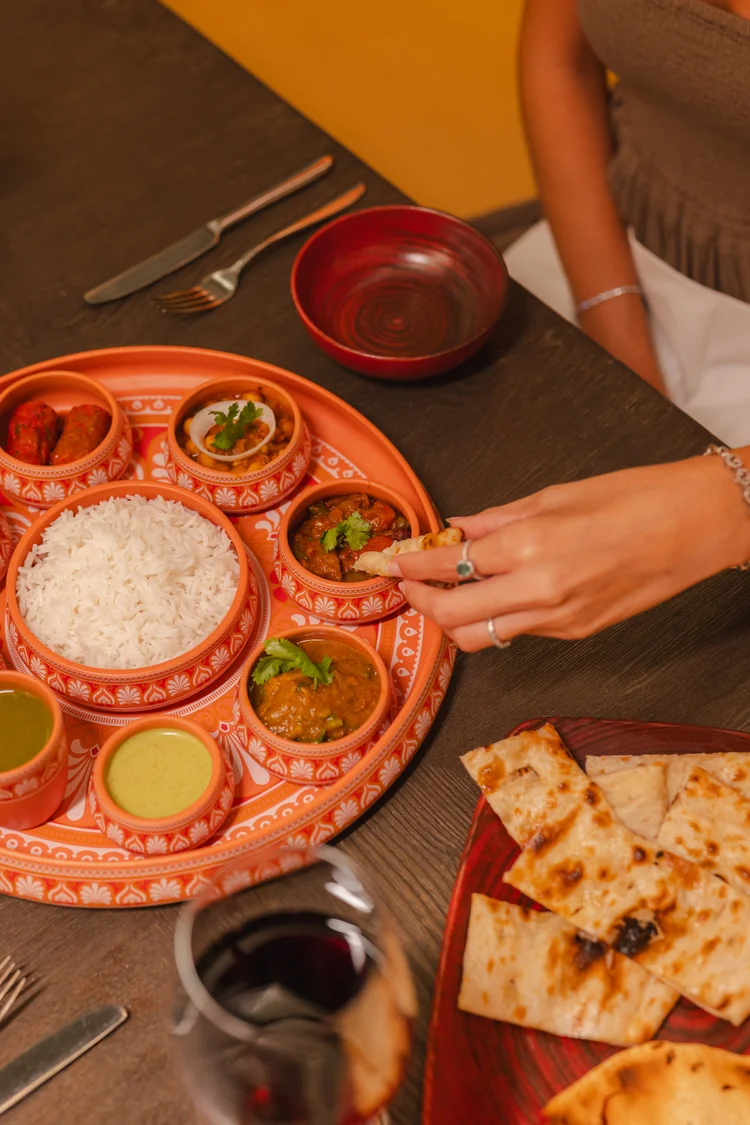 Indian thali platter naan curries rice resort
