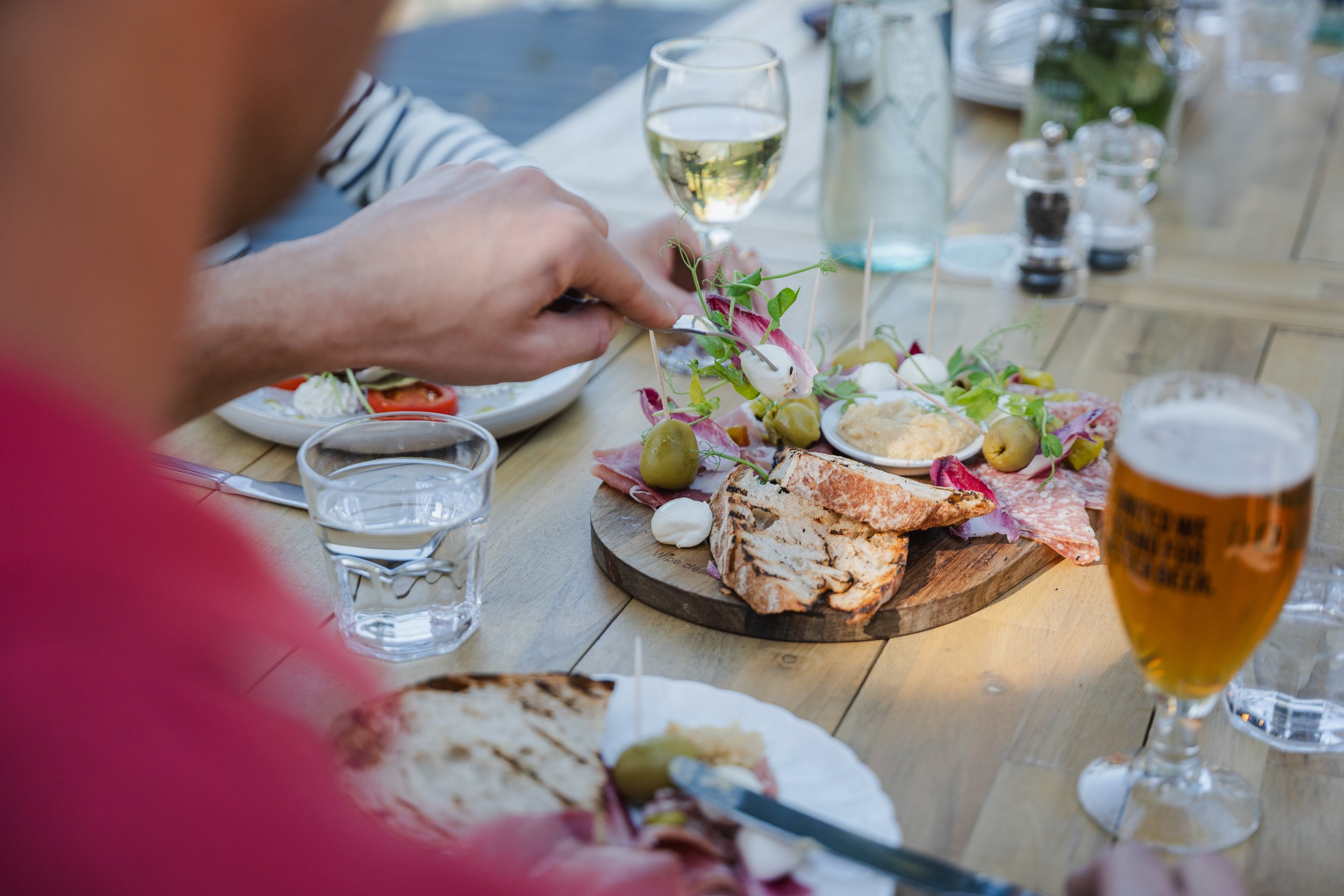 Charcuterie board alfresco dining on hotel terrace