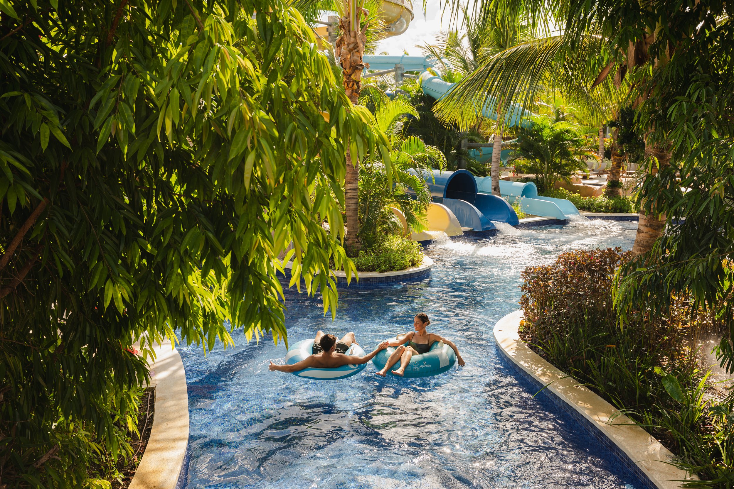 Couple tropical lazy river waterpark resort activities, lifestyle photography London